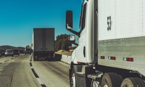 A truck driving in the right lane of the express way