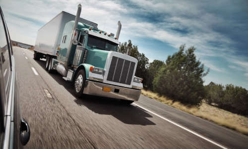 Front of a freight truck from another car's point of view