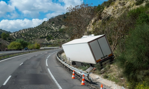 Truck accident on the side of a hill