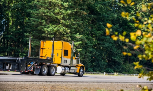 Freight truck with no cargo on a highway